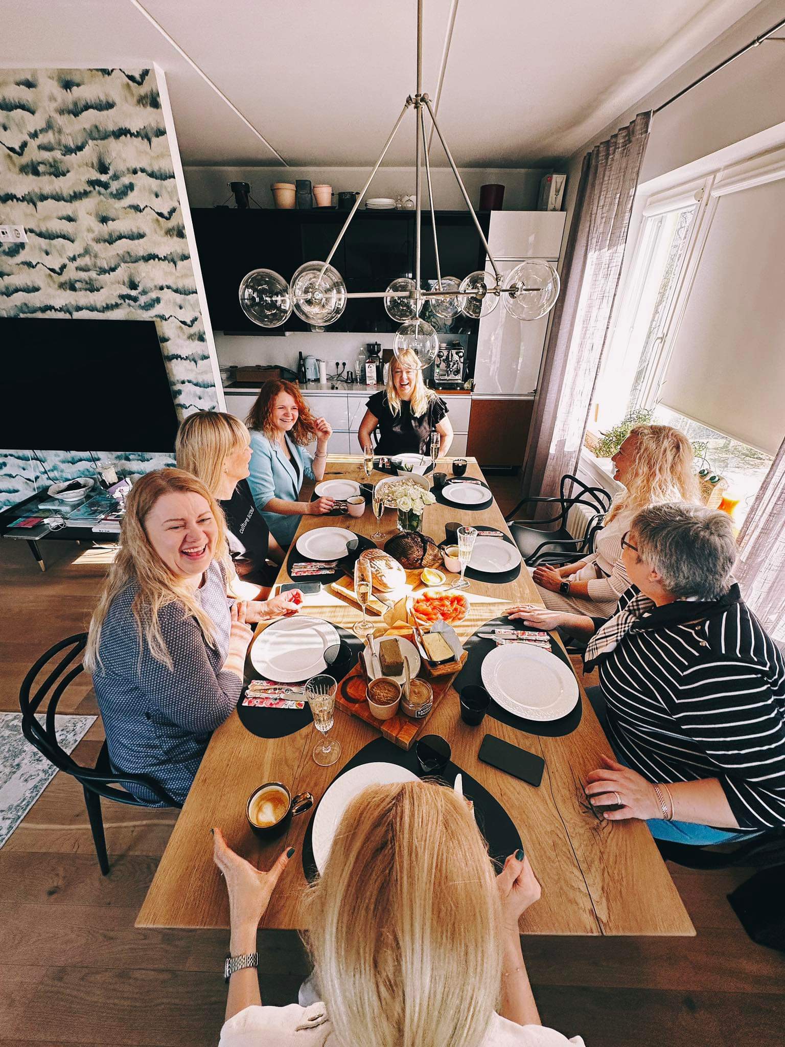 Group of people gathered around the table