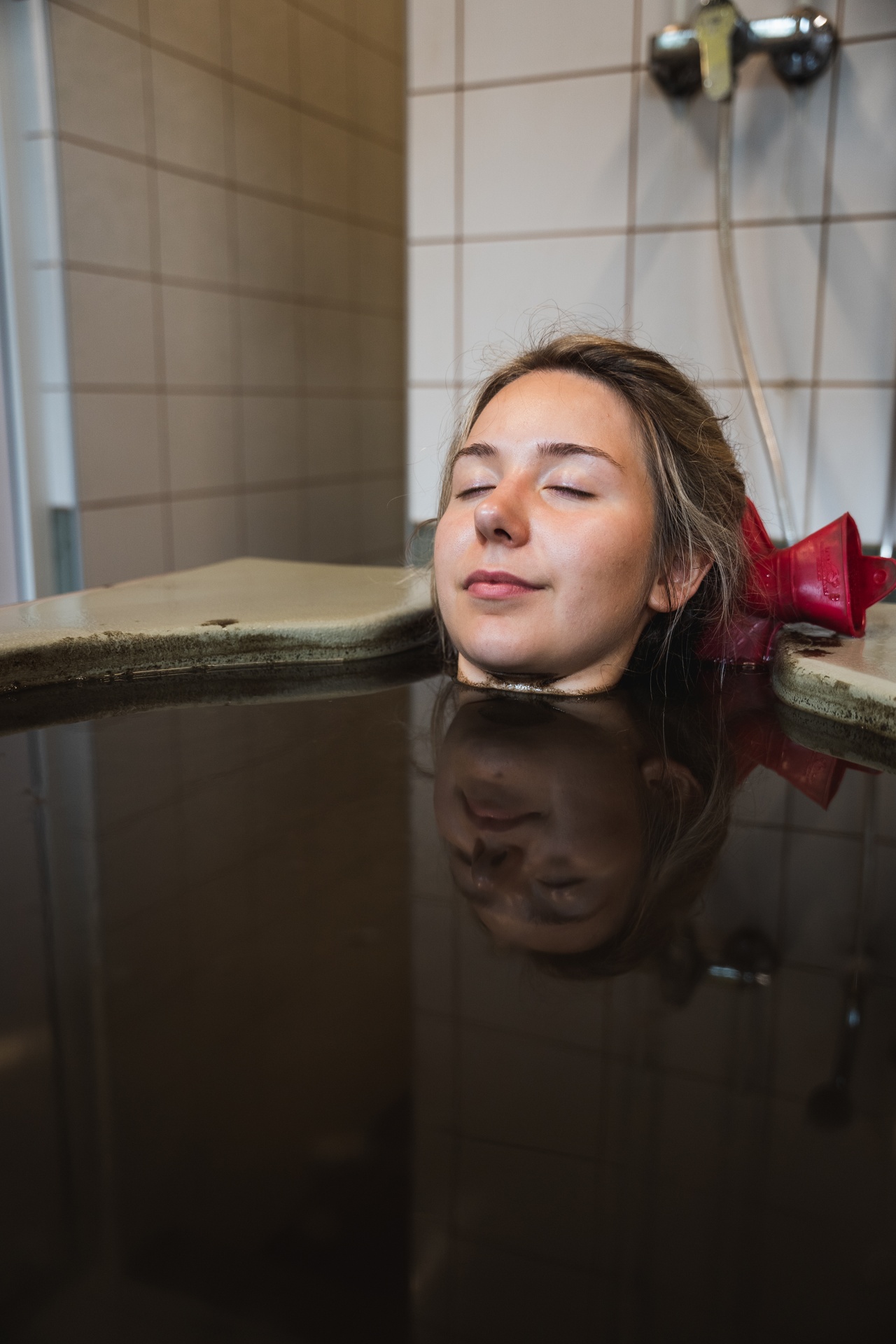 Woman enjoys mud spat at Varska Spa in Setomaa