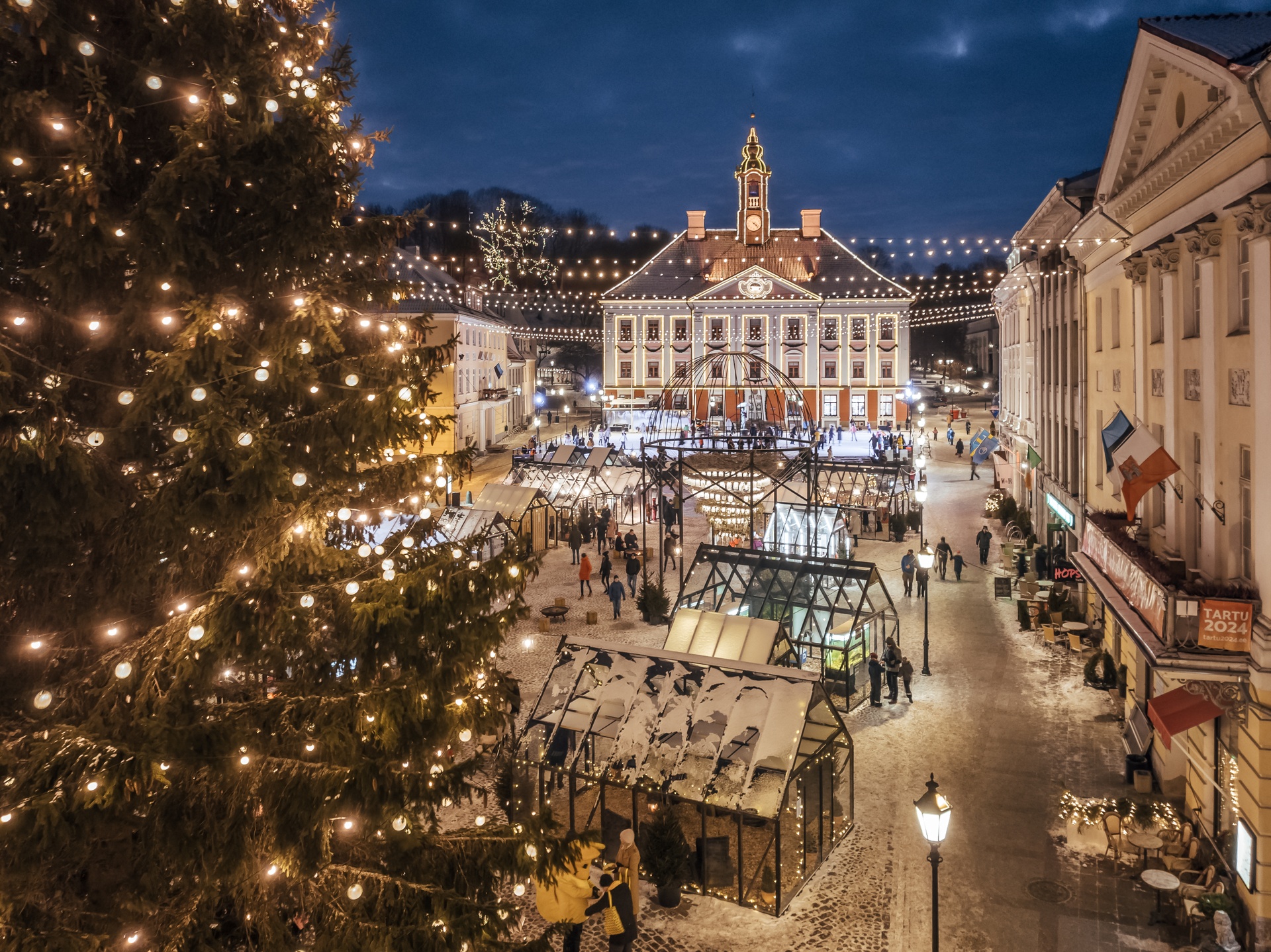 Tartu's Christmas Village at night covered in snow